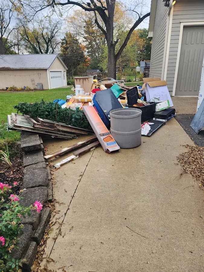 Dumpster being loaded with debris for 3 Yard Dumpster Rental in Anaconda-Deer Lodge County